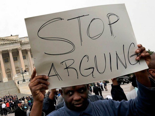 Fordern ein Ende des Streits im Kongre...tranten vor dem Kapitol in Washington   | Foto: AFP