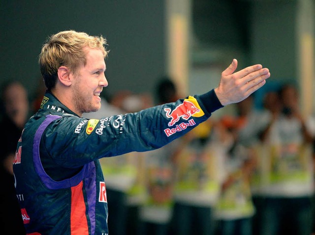 Sebastian Vettel geniet den Triumph.  | Foto: AFP