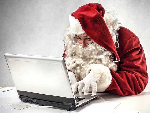 Im Stress: Weihnachtsmann beantwortet seine Post.   | Foto: Olly (Fotolia)