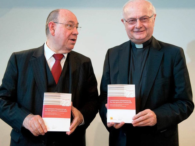 Robert Zollitsch und Nikolaus Schneider  | Foto: dpa