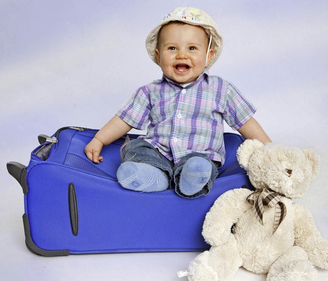 Koffer packen und los:Das Kind strahl...es mit den Eltern in den Urlaub darf?   | Foto: dpa