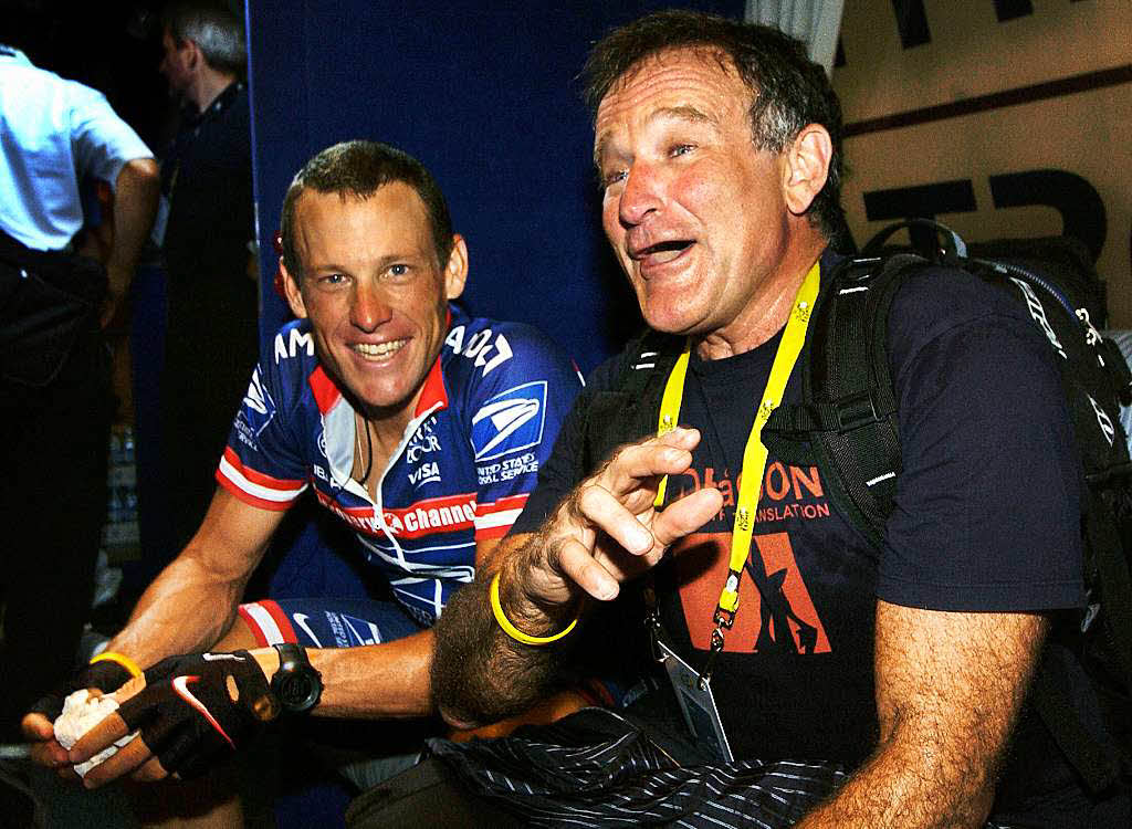 2004: Lance Armstrong mit Robin Williams nachdem Armstrong die 91. Tour de France gewann.