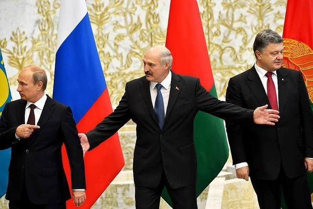 Putin, Poroschenko und der Handschlag von Minsk