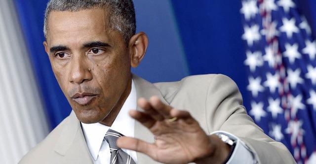 Der  Sommeranzug von Barack Obama bewe...sten (beinahe) mehr als dessen Worte.   | Foto: DPA