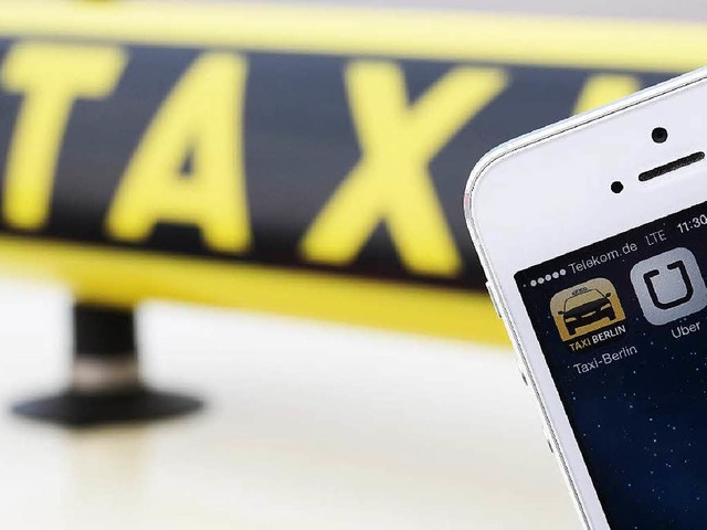 Liegen im Clinch: der Fahrdienst Uber und das Taxigewerbe.  | Foto: dpa