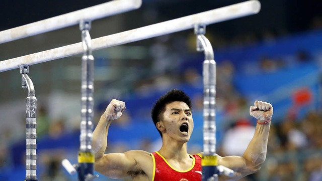 Lin Chaopan freut sich ber seine gelu...ter ber den Titel fr Chinas  Riege.   | Foto: dpa