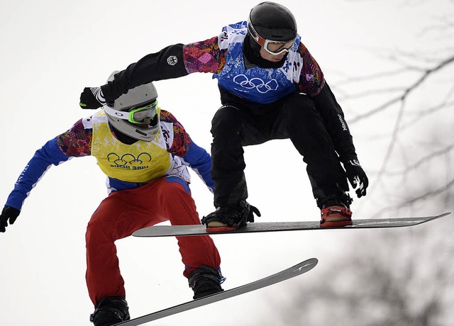 Paul Berg (rechts), der beste Snowboar...erspielen im russischen Sotschi 2014.   | Foto: DPA