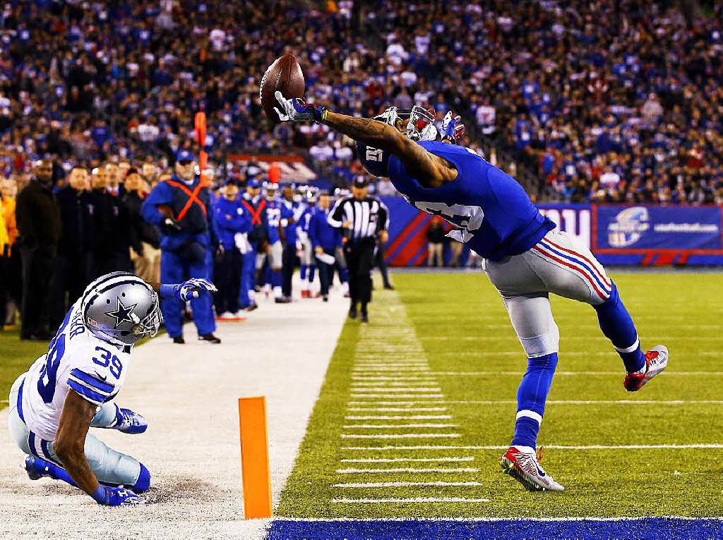 „The Beckham Catch“  Das Foto, mit dem der US- Fotograf Al Bello den 2. Preis in der Kategorie „Sport“ gewinnt, zeigt den American Football  Spieler Beckham, der einen einhndigen Touchdown macht.