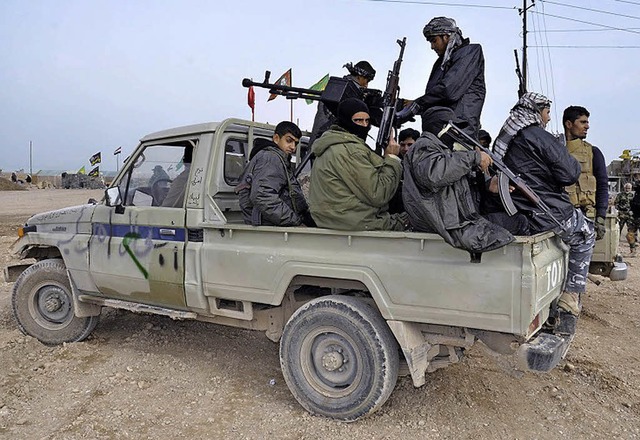 Auch Schiitenmilizen untersttzen den Kampf gegen den IS.    | Foto: DPA