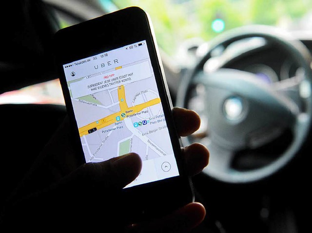 Per Smartphone-App werden die Uber-Fahrer angefordert.   | Foto: DPA