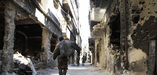 Das Flchtlingsviertel Jarmuk ist durc...gen Kmpfe zu groen Teilen zerstrt.   | Foto: AFP
