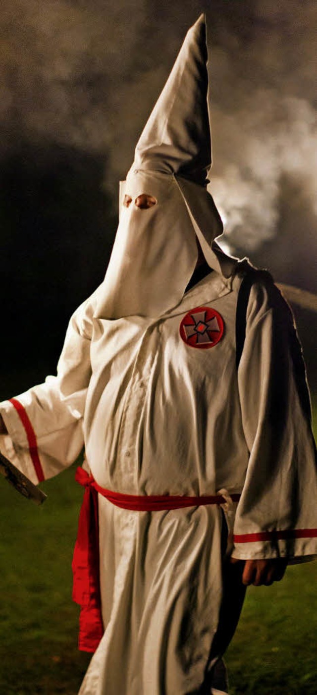 Ein Mitglied der rassistischen Vereinigung Ku-Klux-Klan  | Foto: dpa