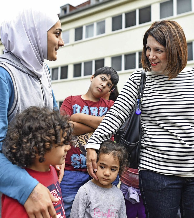 Helfen, dass die Stimmung nicht kippt ...ney   mit Flchtlingen in Heidelberg   | Foto: dpa