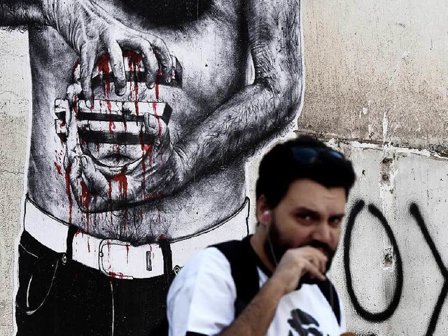 Am Euro klebt Blut: Wandgemlde in Athen   | Foto: AFP