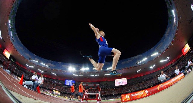 Das Olympiastadion in Peking, genannt ...eitsprung-Weltmeisters Greg Rutherford  | Foto: dpa