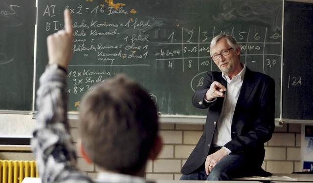 Er  steht immer im Fokus: Der Lehrer   | Foto: Oliver Berg (dpa)