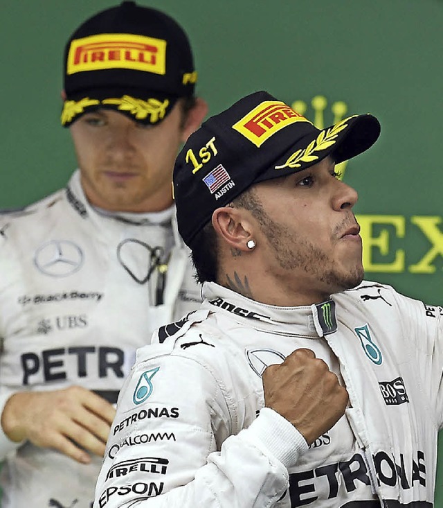 Im Schatten des Weltmeisters: Nico Rosberg (links) und Lewis Hamilton  | Foto: afp