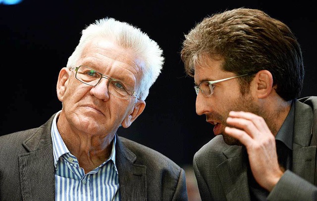 Parteifreunde: Ministerprsident Winfr...er Oberbrgermeister Boris Palmer (r.)  | Foto: dpa