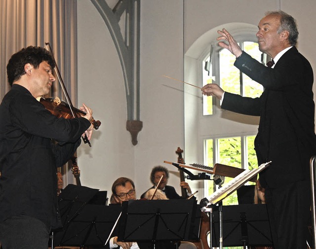 Solist Michael Dinnebier und Dirigent Michael Hardenberg  | Foto: Karig