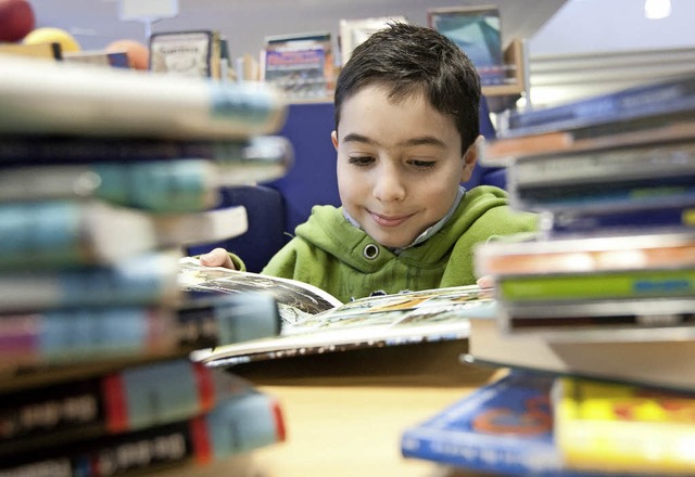 Kleine Leseratten: Kinder gehren zu d...n der Stadtbibliothek Donaueschingen.   | Foto: dpa