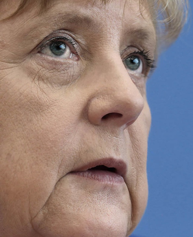 Merkel am Donnerstag vor der Bundespressekonferenz   | Foto: dpa