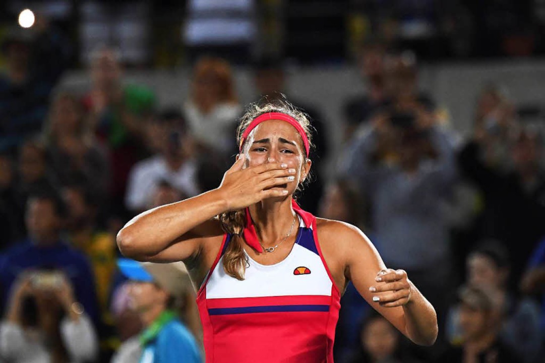 Monica Puig feiert nach dem Sieg gegen Kerber.  | Foto: AFP