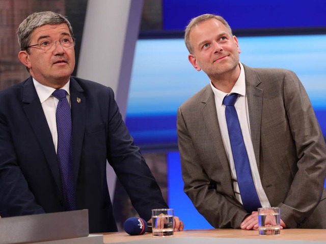 Lorenz Caffier von der CDU wirkt anges... souvern: Gesichter eines Wahlabends.  | Foto: AFP