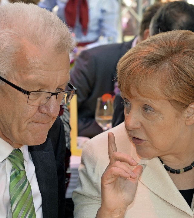 Ziemlich gute Freunde: Winfried Kretschmann und Angela Merkel   | Foto: dpa