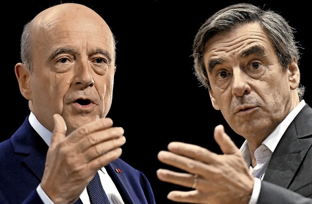 Alain Jupp (links) und Franois Fillon gehen in die Stichwahl.   | Foto: AFP