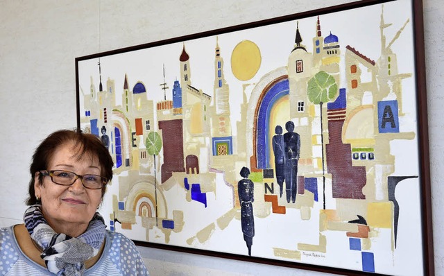 Die Schnauer Kunstmalerin Margarete R...gen Bild einer portugiesischen Stadt.   | Foto: Georg Diehl