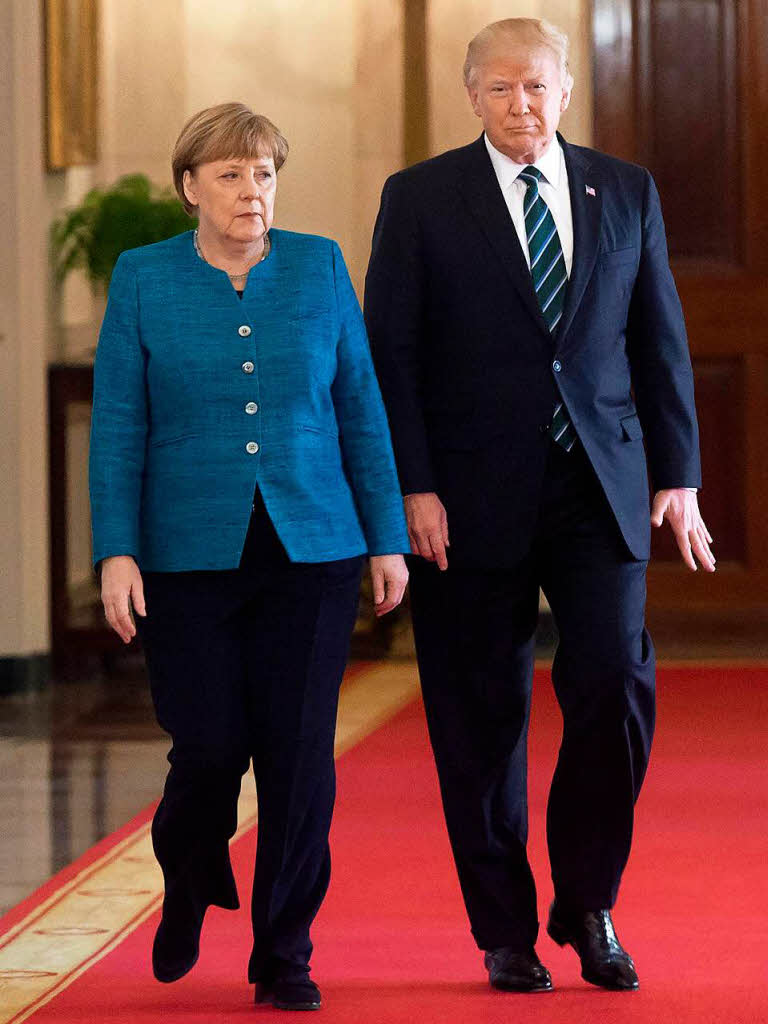 Fotos vom ersten Treffen zwischen Donald Trump und Angela Merkel.