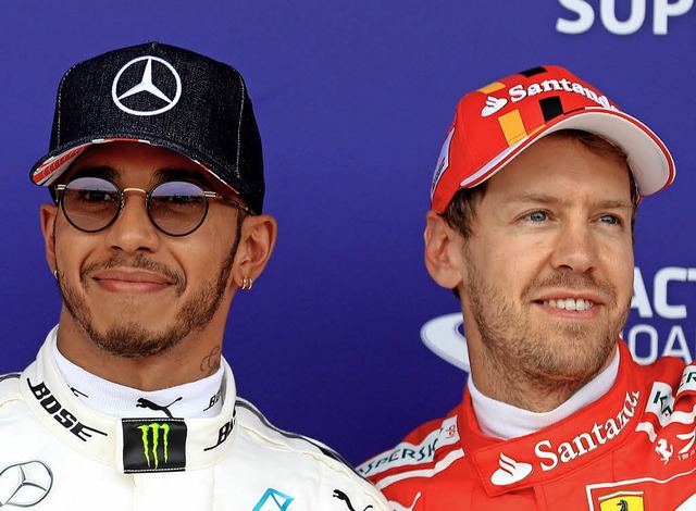 Die Kontrahenten: Lewis Hamilton (links) und Sebastian Vettel   | Foto: dpa