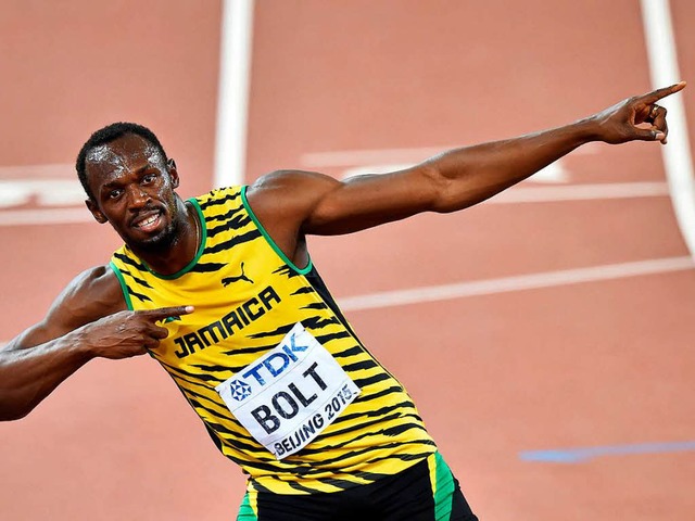 Das wurde Usain Bolts Markenzeichen au...tstoffbahn: die Pfeil-und-Bogen-Geste   | Foto: AFP