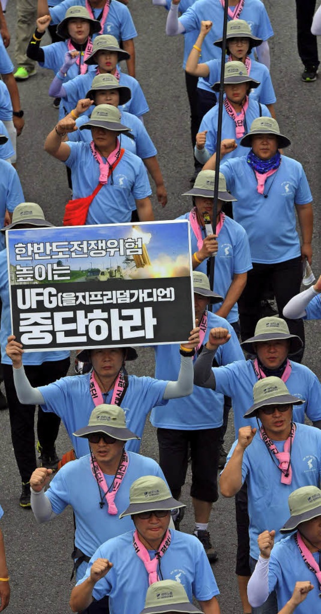 Demonstranten protestieren in Seoul  gegen das US-Militr.   | Foto: AFP/dpa