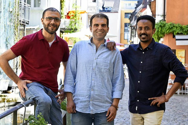 Angehende Unternehmer (von links): Eli...yrien, daneben Hamdi Salih aus Eritrea  | Foto: Thomas Kunz