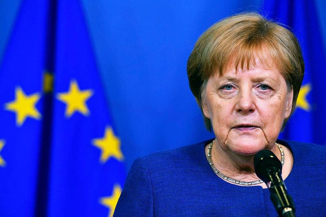 Angela Merkel nach zhen Verhandlungen  | Foto: dpa