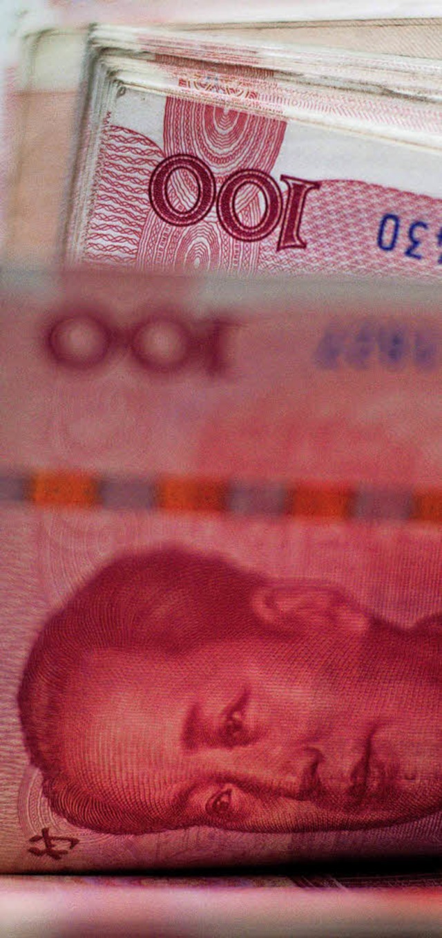Wird abgewertet: die chinesische Whrung Renminbi  | Foto: AFP