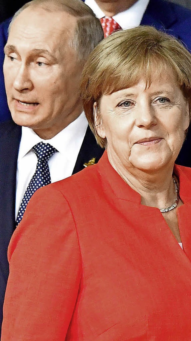 Wladimir Putin und Angela Merkel  | Foto: afp