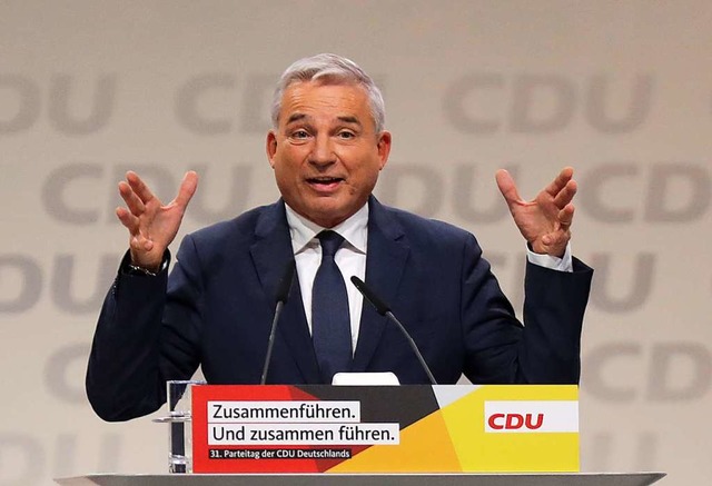 Der CDU-Landesvorsitzende von Baden-W...n CDU-Vorsitzenden zu den Delegierten.  | Foto: dpa