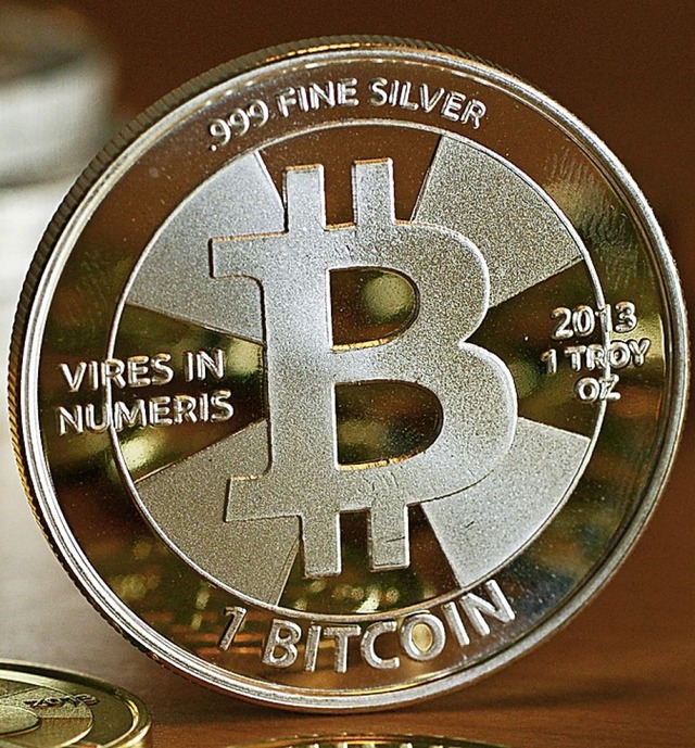 Bitcoin-Mnze   | Foto: Jens Kalaene (dpa)