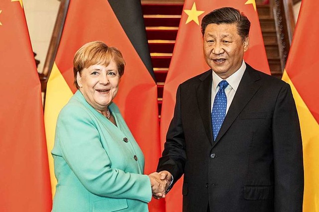 Kanzlerin Angela Merkel und Chinas Staatschef Xi Jinping  | Foto: Michael Kappeler (dpa)