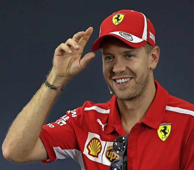 Hat das Lachen trotz schwacher Saison noch nicht verlernt: Sebastian Vettel  | Foto: Ng Han Guan