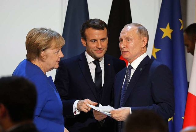 Angela Merkel und Wladimir Putin mit F...aine-Gipfel in Paris Anfang der Woche.  | Foto: LUDOVIC MARIN (AFP)