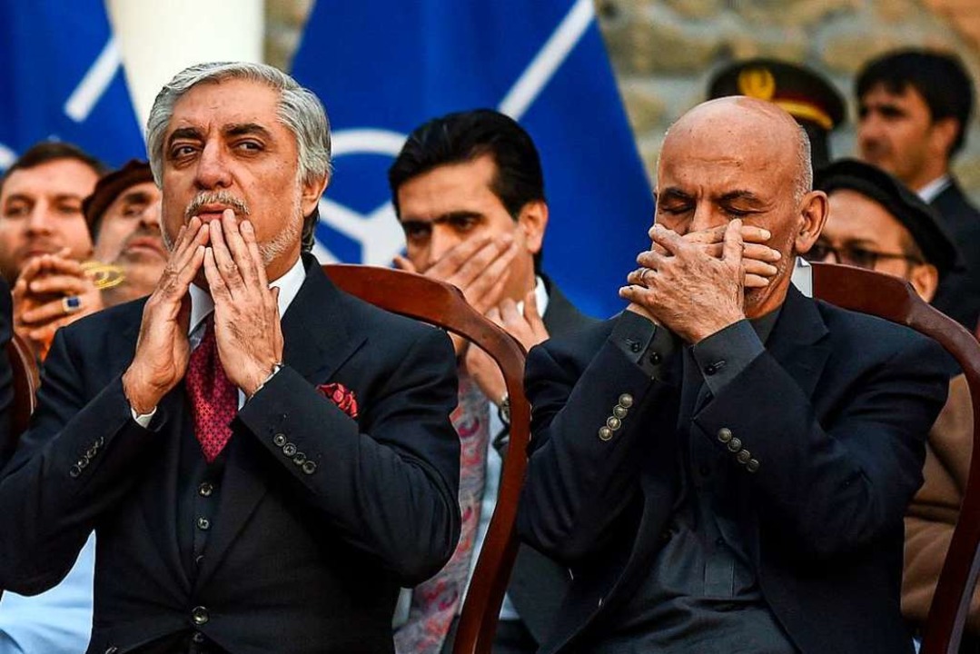 Amtsinhaber Ghani (rechts) und der unterlegene Herausforderer Abdullah  | Foto: WAKIL KOHSAR (AFP)