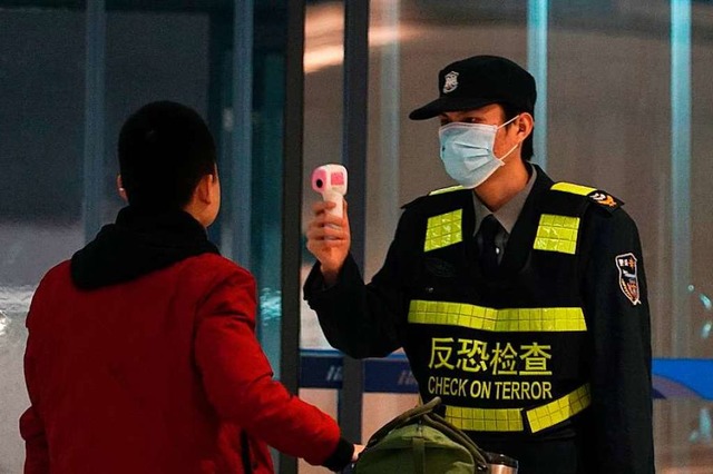 Corona-Kontrolle in Wuhan: Kann man den Daten aus China trauen?  | Foto: Dake Kang (dpa)