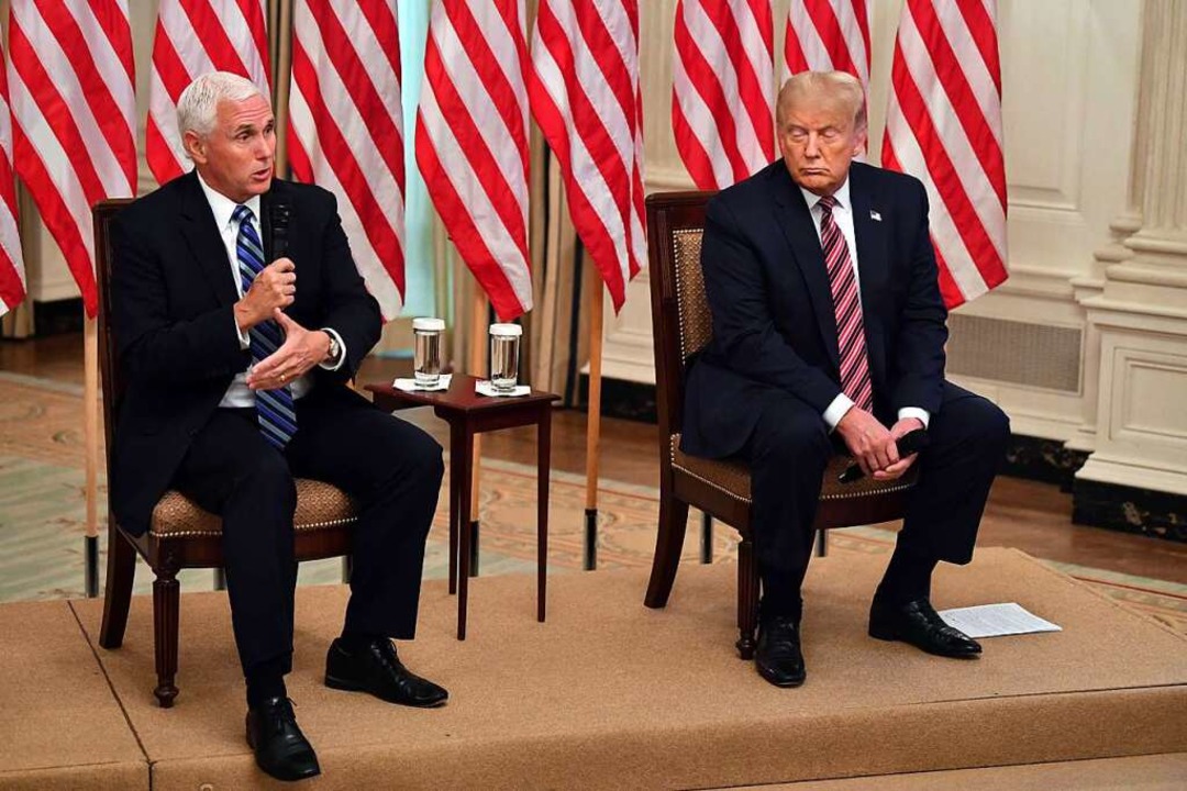 Pence an der Seite von Donald Trump.  | Foto: NICHOLAS KAMM (AFP)