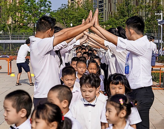 Chinesische Schler in Wuhan  | Foto: STR (AFP)