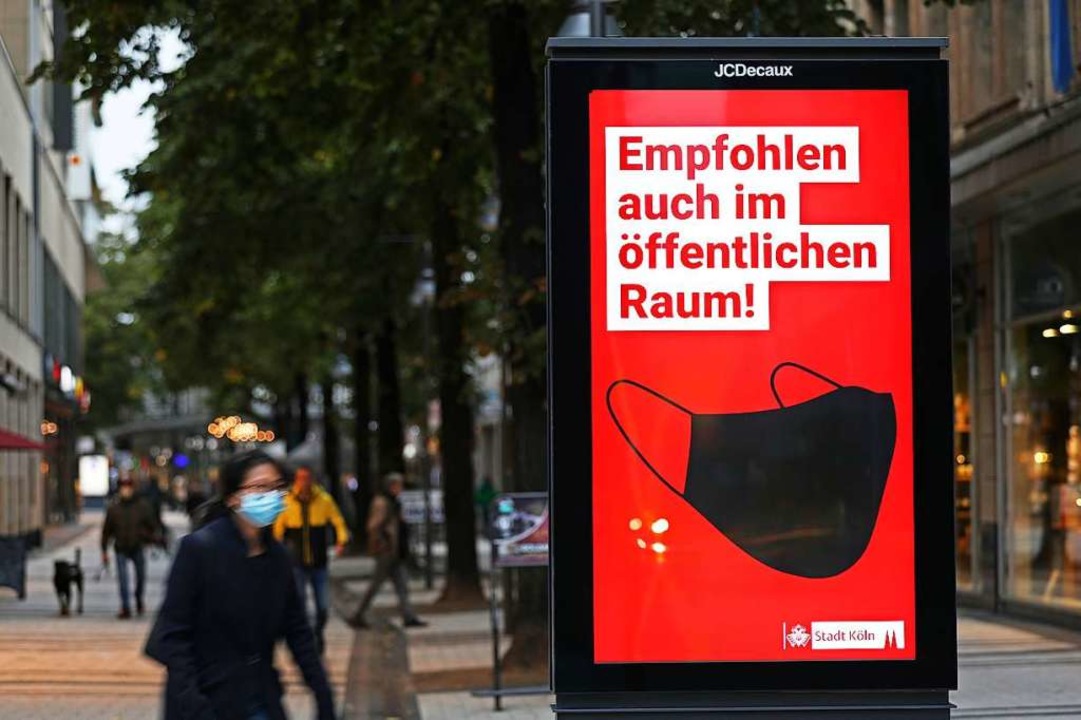In Kln rt die Stadt bereits zum Maskentragen im ffentlichen Raum.  | Foto: Oliver Berg (dpa)