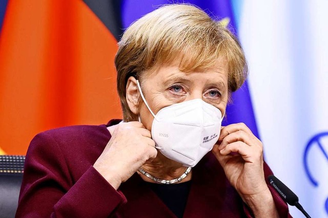 Kanzlerin Angela Merkel &#8211; hier a...etzung der Manahmen nicht zu zaudern.  | Foto: Kenzo Tribouillard (dpa)