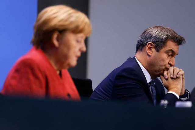 Bundeskanzlerin Angela Merkel bert si...ute wieder mit den Ministerprsidenten  | Foto: Odd Andersen (dpa)